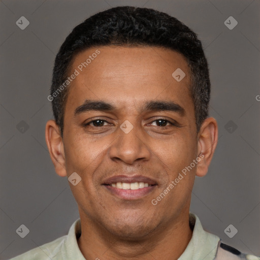 Joyful latino adult male with short  black hair and brown eyes