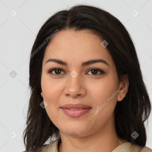 Joyful latino young-adult female with medium  brown hair and brown eyes