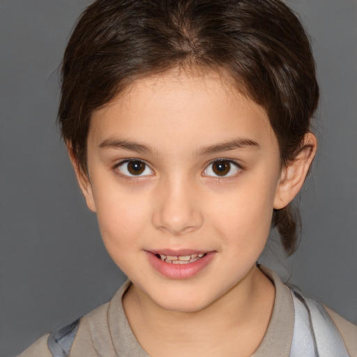 Joyful white child female with medium  brown hair and brown eyes