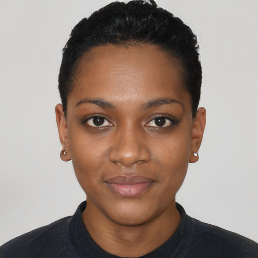 Joyful black young-adult female with short  black hair and brown eyes