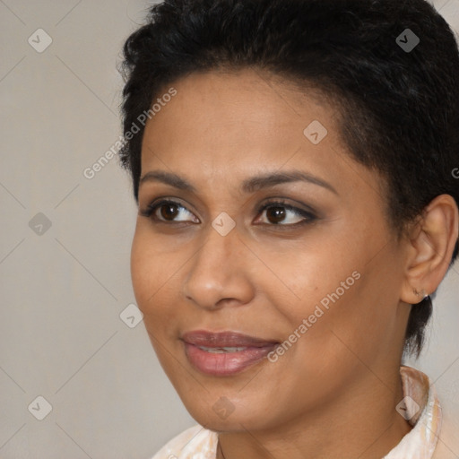 Joyful latino young-adult female with short  brown hair and brown eyes