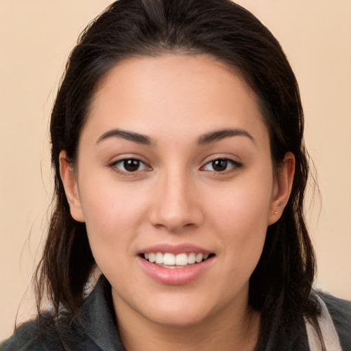 Joyful white young-adult female with long  brown hair and brown eyes