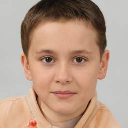 Joyful white child male with short  brown hair and brown eyes