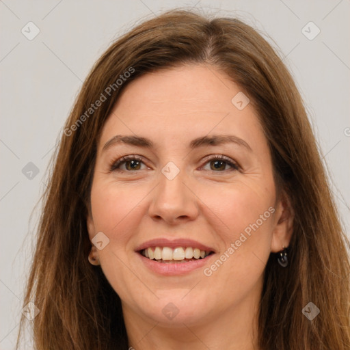 Joyful white adult female with long  brown hair and brown eyes