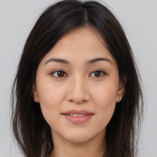 Joyful white young-adult female with long  brown hair and brown eyes