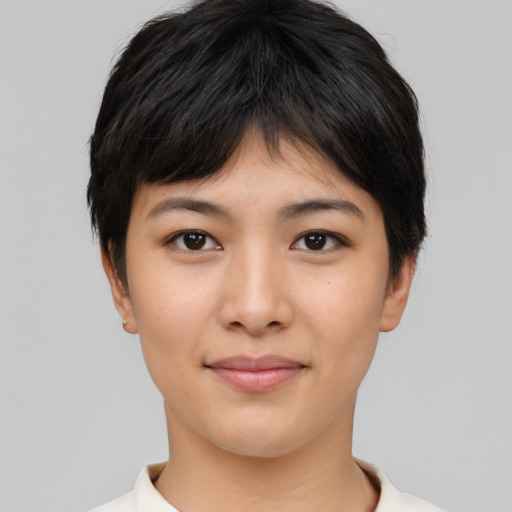 Joyful asian young-adult female with short  black hair and brown eyes