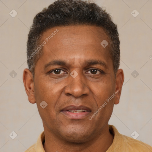 Joyful black adult male with short  brown hair and brown eyes