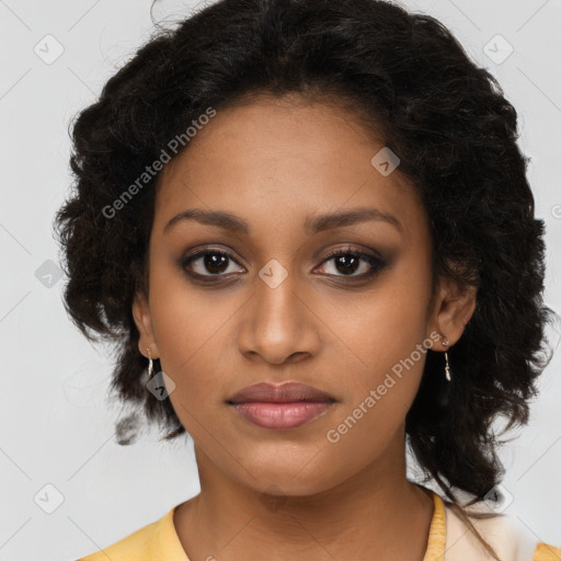 Joyful black young-adult female with long  brown hair and brown eyes