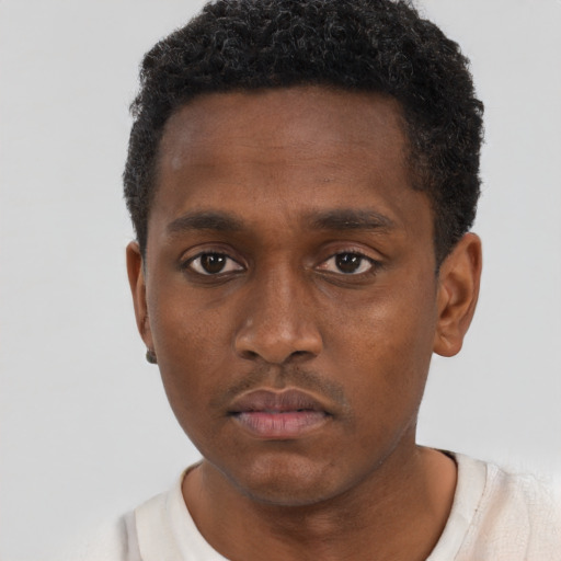 Neutral black young-adult male with short  brown hair and brown eyes
