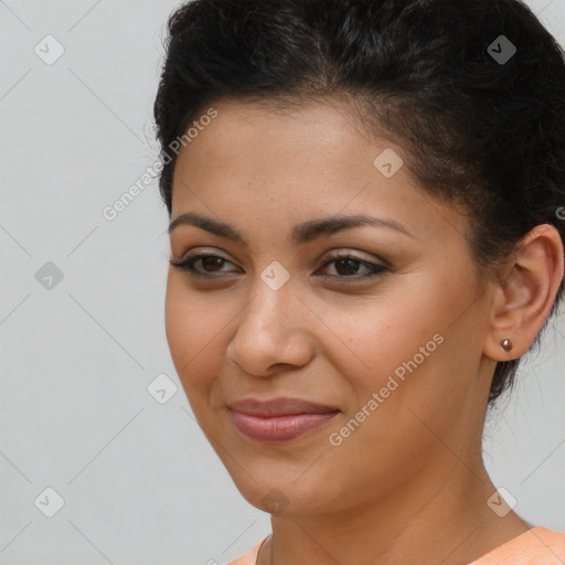 Joyful latino young-adult female with short  brown hair and brown eyes