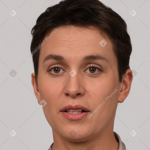 Joyful white young-adult female with short  brown hair and brown eyes