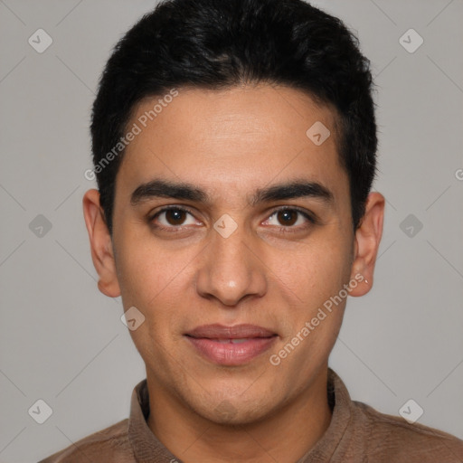 Joyful latino young-adult male with short  black hair and brown eyes