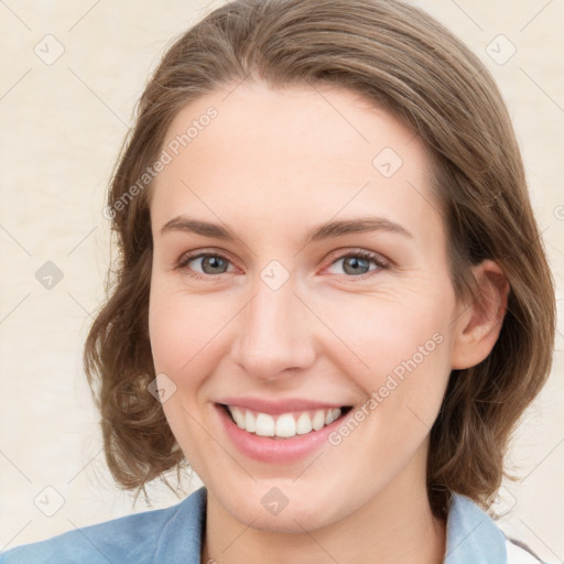 Joyful white young-adult female with medium  brown hair and green eyes