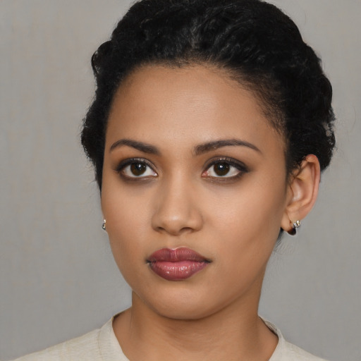 Neutral latino young-adult female with short  black hair and brown eyes
