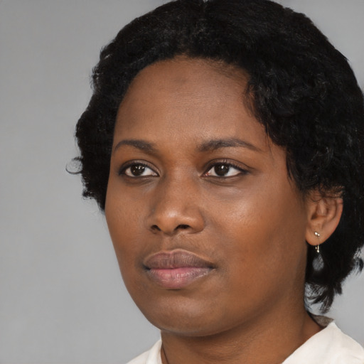 Neutral black young-adult female with short  brown hair and brown eyes
