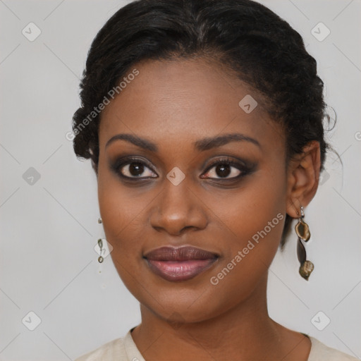 Joyful black young-adult female with short  brown hair and brown eyes