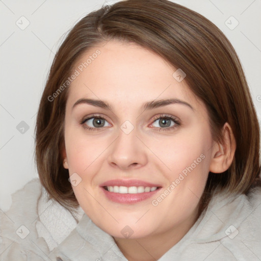 Joyful white young-adult female with medium  brown hair and blue eyes