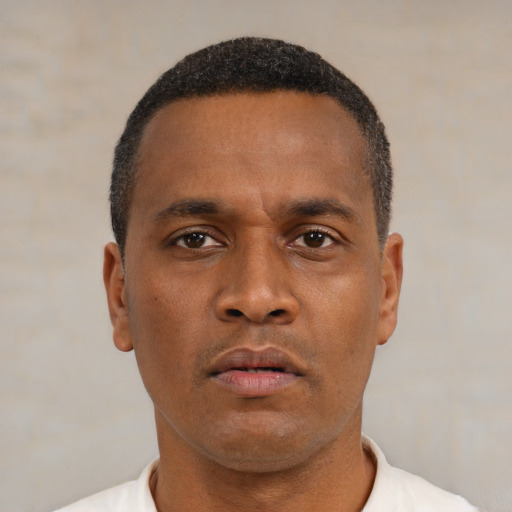 Neutral latino young-adult male with short  brown hair and brown eyes