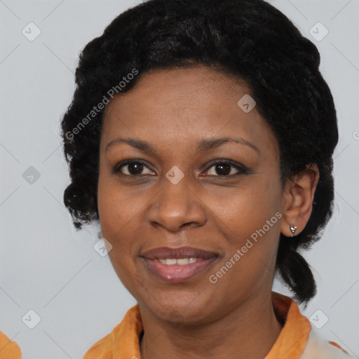 Joyful black adult female with short  black hair and brown eyes