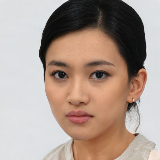 Neutral asian young-adult female with medium  black hair and brown eyes