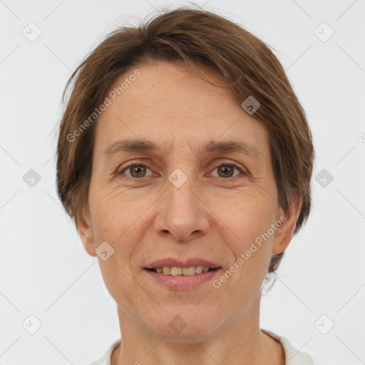 Joyful white adult female with short  brown hair and grey eyes