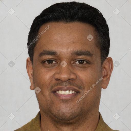 Joyful latino young-adult male with short  black hair and brown eyes