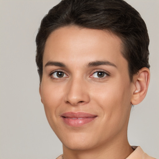 Joyful white young-adult female with short  brown hair and brown eyes