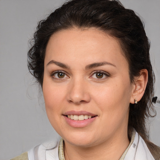 Joyful white young-adult female with medium  brown hair and brown eyes