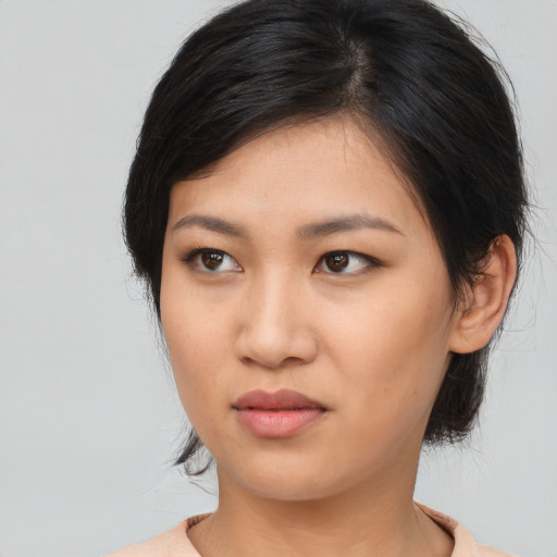 Neutral asian young-adult female with medium  brown hair and brown eyes