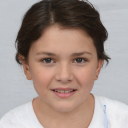 Joyful white child female with medium  brown hair and brown eyes