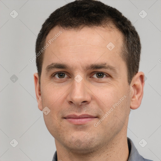 Joyful white young-adult male with short  brown hair and brown eyes