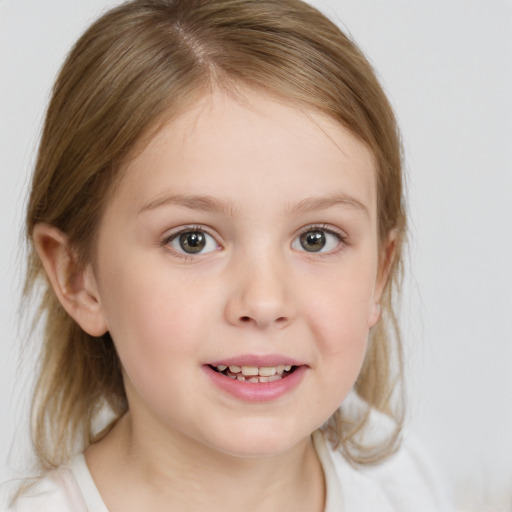 Joyful white child female with medium  brown hair and blue eyes