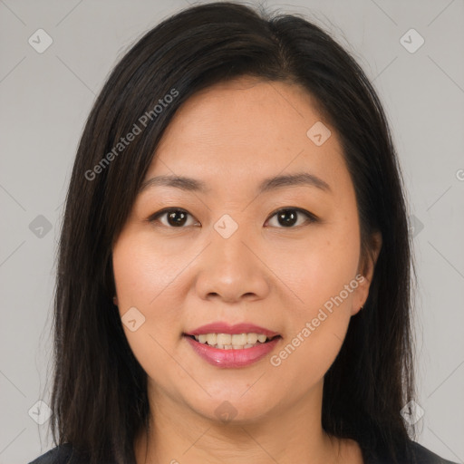 Joyful asian young-adult female with long  brown hair and brown eyes