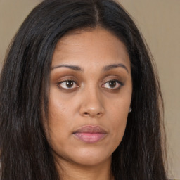 Joyful asian young-adult female with long  brown hair and brown eyes