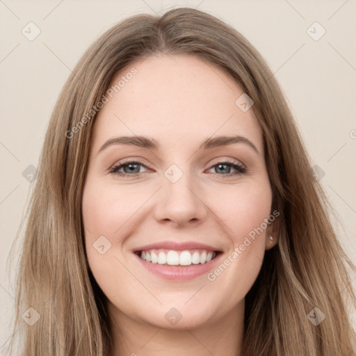 Joyful white young-adult female with long  brown hair and green eyes