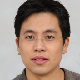 Neutral asian young-adult male with short  brown hair and brown eyes