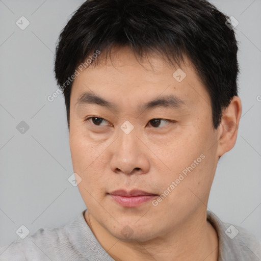 Neutral asian young-adult male with short  brown hair and brown eyes