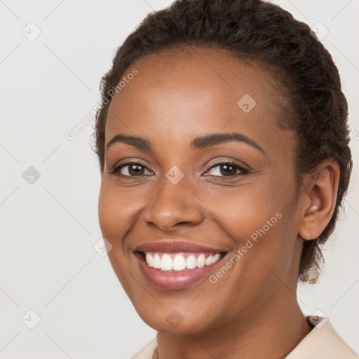 Joyful latino young-adult female with short  brown hair and brown eyes