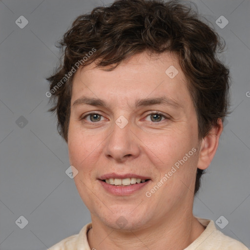 Joyful white adult female with short  brown hair and brown eyes