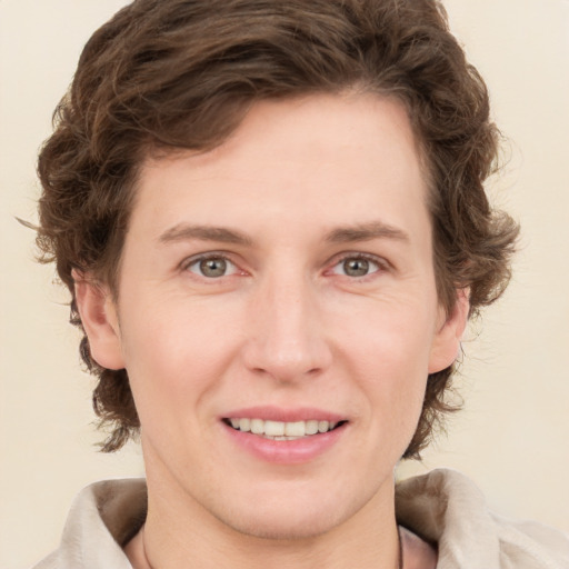 Joyful white young-adult female with medium  brown hair and green eyes