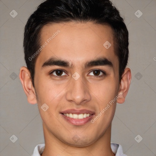 Joyful latino young-adult male with short  brown hair and brown eyes