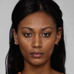 Neutral black young-adult female with long  brown hair and brown eyes