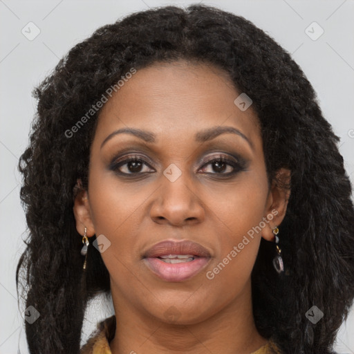 Joyful black young-adult female with long  brown hair and brown eyes