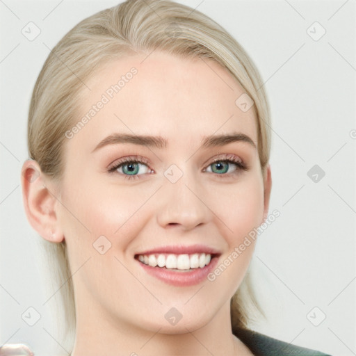 Joyful white young-adult female with long  brown hair and blue eyes