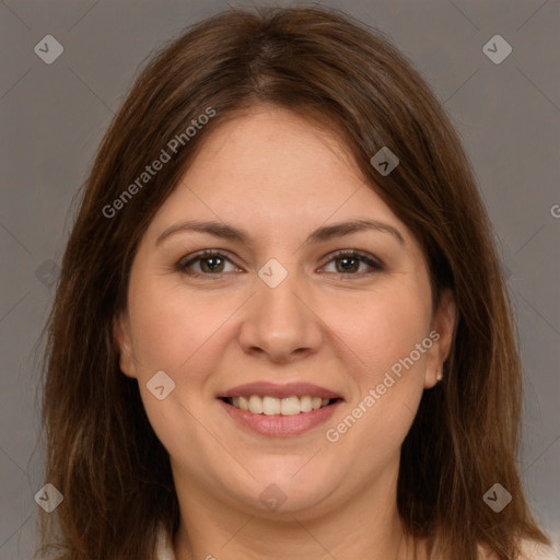 Joyful white young-adult female with long  brown hair and brown eyes