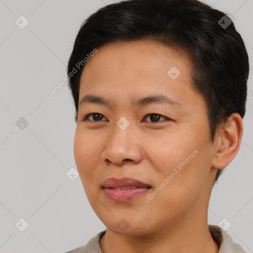 Joyful asian young-adult male with short  black hair and brown eyes