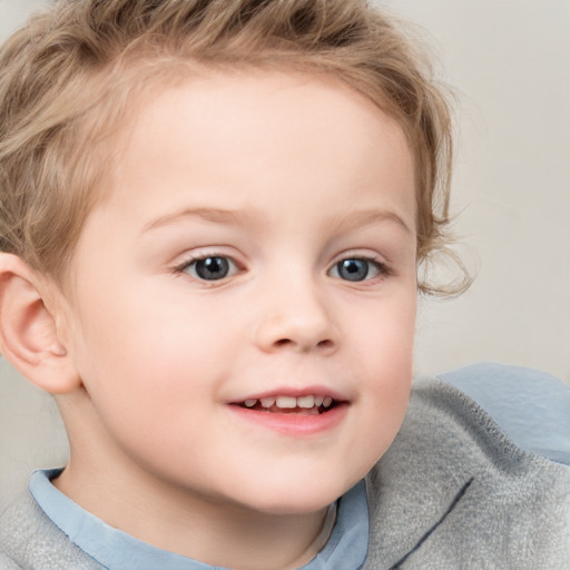 Joyful white child female with short  brown hair and blue eyes