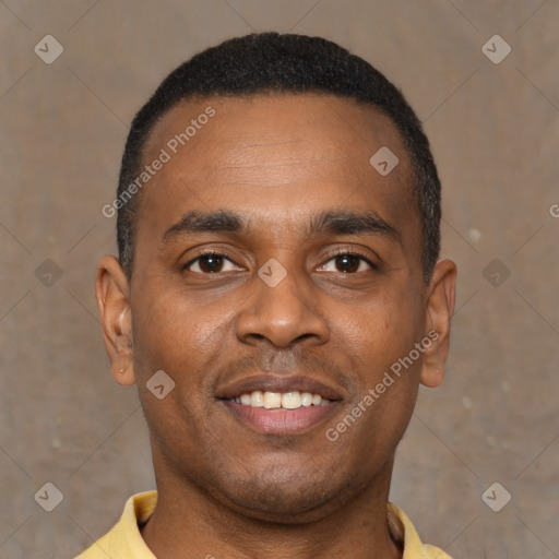 Joyful black young-adult male with short  brown hair and brown eyes