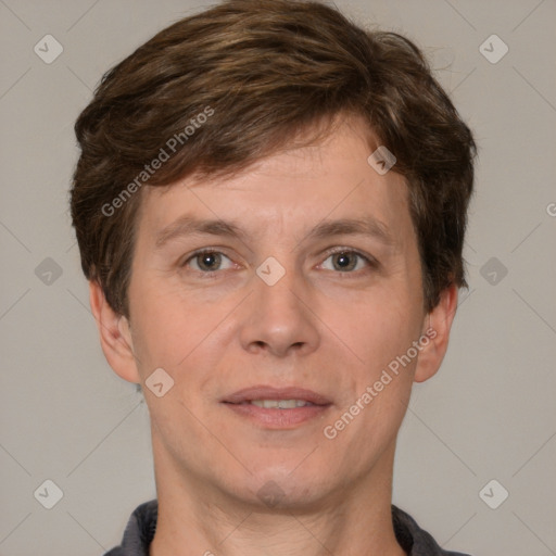 Joyful white adult male with short  brown hair and brown eyes