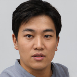 Neutral asian young-adult male with short  black hair and brown eyes